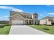 Charming two-story brick home with a spacious driveway and a well-maintained lawn, offering modern comfort at 124 Aj Welch Jr Way, Mcdonough, GA 30252