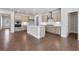 Spacious eat-in kitchen boasts stainless appliances, large island, and hardwood floors at 124 Aj Welch Jr Way, Mcdonough, GA 30252