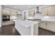 Open kitchen with large center island, stainless steel appliances, and hardwood floors at 124 Aj Welch Jr Way, Mcdonough, GA 30252