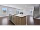 Modern kitchen featuring a large island, stainless steel appliances, and open floor plan, great for entertaining guests at 124 Aj Welch Jr Way, Mcdonough, GA 30252