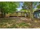 Cozy backyard featuring a wooden deck perfect for outdoor relaxation and entertaining, surrounded by mature trees at 1248 Conway Rd, Decatur, GA 30030