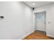 Clean, minimalist entryway with light wood flooring and a stylish white door at 1248 Conway Rd, Decatur, GA 30030