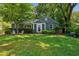 Charming single-story home with a lush green lawn and mature trees in a quiet neighborhood setting at 1248 Conway Rd, Decatur, GA 30030