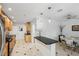 Modern kitchen with stainless steel appliances, light wood cabinets, and black and white tile flooring at 1248 Conway Rd, Decatur, GA 30030