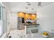 Bright eat-in kitchen features stainless steel appliances, light wood cabinetry, and black and white tile flooring at 1248 Conway Rd, Decatur, GA 30030