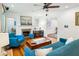 Bright living room with hardwood floors, fireplace, and stylish blue furniture at 1248 Conway Rd, Decatur, GA 30030