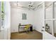 Bright office space with beadboard walls, a ceiling fan, and a modern desk setup at 1248 Conway Rd, Decatur, GA 30030