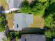 Aerial view of the property showing the roof, surrounding trees, and backyard at 1575 Linda Sw Way, Atlanta, GA 30310