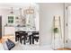 Stylish dining area and kitchen with stainless steel hood and floating shelves at 1575 Linda Sw Way, Atlanta, GA 30310