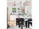 Stylish dining area and kitchen with stainless steel hood and floating shelves at 1575 Linda Sw Way, Atlanta, GA 30310
