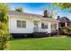 Charming home with light blue door, black trim, and a well-maintained lawn at 1575 Linda Sw Way, Atlanta, GA 30310