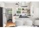 Well-lit kitchen with stainless steel appliances, granite countertops, and bright white cabinets at 1575 Linda Sw Way, Atlanta, GA 30310