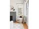 Cozy chair beside fireplace, hardwood floors, and stylish furniture by bright window at 1575 Linda Sw Way, Atlanta, GA 30310
