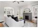 Inviting living room featuring a brick fireplace, hardwood floors, and modern furniture at 1575 Linda Sw Way, Atlanta, GA 30310