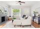 Bright living room with fireplace, hardwood floors, and stylish furniture at 1575 Linda Sw Way, Atlanta, GA 30310