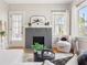 Inviting living room featuring a brick fireplace, hardwood floors, and modern furniture at 1575 Linda Sw Way, Atlanta, GA 30310