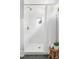 Shower with white subway tile, shower head, alcove, and wooden stool at 1575 Linda Sw Way, Atlanta, GA 30310