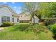 Large backyard with a storage shed and wooden fence surrounding the property at 1284 Charter Club Ct, Lawrenceville, GA 30043