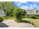 Landscaped backyard features a concrete patio, green lawn, shed, and mature trees for outdoor enjoyment at 1284 Charter Club Ct, Lawrenceville, GA 30043