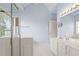 Bright bathroom featuring double vanity sinks, shower and tub at 1284 Charter Club Ct, Lawrenceville, GA 30043
