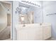 Bathroom featuring double vanity sinks, large mirror and tiled floors at 1284 Charter Club Ct, Lawrenceville, GA 30043