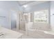 Bright bathroom features a separate shower and soaking tub at 1284 Charter Club Ct, Lawrenceville, GA 30043