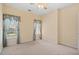 Bright bedroom with carpet, ceiling fan, and two large windows with blue decorative cornices at 1284 Charter Club Ct, Lawrenceville, GA 30043