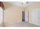 Cozy bedroom with plush carpeting, a ceiling fan, a walk-in closet, and a separate closet at 1284 Charter Club Ct, Lawrenceville, GA 30043
