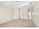 Bright bedroom with neutral carpeting, a ceiling fan and ensuite bathroom at 1284 Charter Club Ct, Lawrenceville, GA 30043