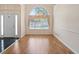 Welcoming foyer with hardwood floors, chandelier, and arched window at 1284 Charter Club Ct, Lawrenceville, GA 30043