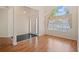 Hardwood foyer with large chandelier and natural light at 1284 Charter Club Ct, Lawrenceville, GA 30043