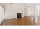 Spacious living room with hardwood floors and a classic fireplace at 1284 Charter Club Ct, Lawrenceville, GA 30043
