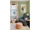 Close-up view of a cozy bedroom featuring neutral decor and a comfortable armchair at 1611 Belmont Sw Ave, Atlanta, GA 30310
