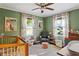 Charming bedroom featuring natural light, neutral colored walls, and a crib at 1611 Belmont Sw Ave, Atlanta, GA 30310