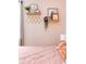 Close up of bedroom decor featuring shelves with pictures and plants at 1611 Belmont Sw Ave, Atlanta, GA 30310