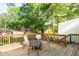 Charming outdoor deck with seating area, providing a relaxing view of the surrounding greenery at 1611 Belmont Sw Ave, Atlanta, GA 30310