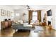 Bright living room with hardwood floors, modern furniture, and a decorative fireplace at 1611 Belmont Sw Ave, Atlanta, GA 30310