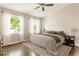 Cozy bedroom featuring natural light, a ceiling fan, hardwood floors, and neutral decor at 1611 Belmont Sw Ave, Atlanta, GA 30310