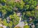 Aerial shot showcasing the home's .35 acre lot surrounded by lush greenery and mature trees at 5223 Hollyfield Dr, Stone Mountain, GA 30088