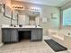 Well-lit bathroom with double sink vanity, soaking tub, and modern fixtures at 5223 Hollyfield Dr, Stone Mountain, GA 30088