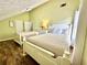 Bright bedroom with two beds, wood floors, and a comfortable setting with plenty of natural light at 5223 Hollyfield Dr, Stone Mountain, GA 30088