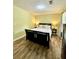 Relaxing bedroom with hardwood floors, neutral paint and ceiling fan at 5223 Hollyfield Dr, Stone Mountain, GA 30088