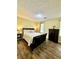 Relaxing bedroom with hardwood floors, neutral paint and ceiling fan at 5223 Hollyfield Dr, Stone Mountain, GA 30088