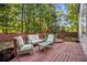 Outdoor deck with seating and furniture, perfect for relaxing and entertaining guests at 5223 Hollyfield Dr, Stone Mountain, GA 30088