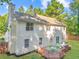 Two-story home featuring large windows, neutral color palette, and a spacious backyard at 5223 Hollyfield Dr, Stone Mountain, GA 30088