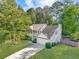 Charming two-story home with a well-maintained lawn, two-car garage, and balcony at 5223 Hollyfield Dr, Stone Mountain, GA 30088