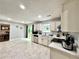Open kitchen layout featuring white cabinetry, stainless steel appliances, and backyard access, ideal for modern living at 5223 Hollyfield Dr, Stone Mountain, GA 30088