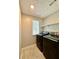 Modern laundry room with a washer and dryer and a bright window with natural light at 5223 Hollyfield Dr, Stone Mountain, GA 30088