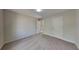 This bedroom features neutral carpet, fresh paint, and abundant light at 1206 Kern Cv, Mcdonough, GA 30253