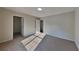 This bedroom features neutral carpet, fresh paint, and abundant light at 1206 Kern Cv, Mcdonough, GA 30253